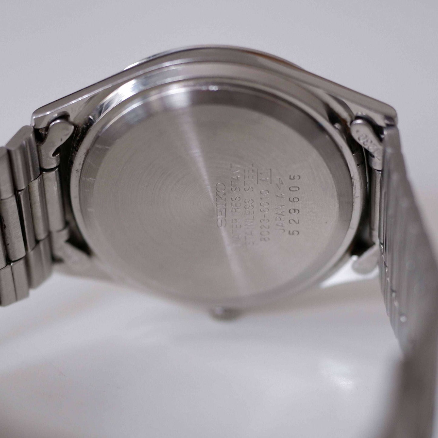 Seiko SQ Vintage Ladies Watch: 80s Silver, Blue Dial, Day Date Window, Back Side