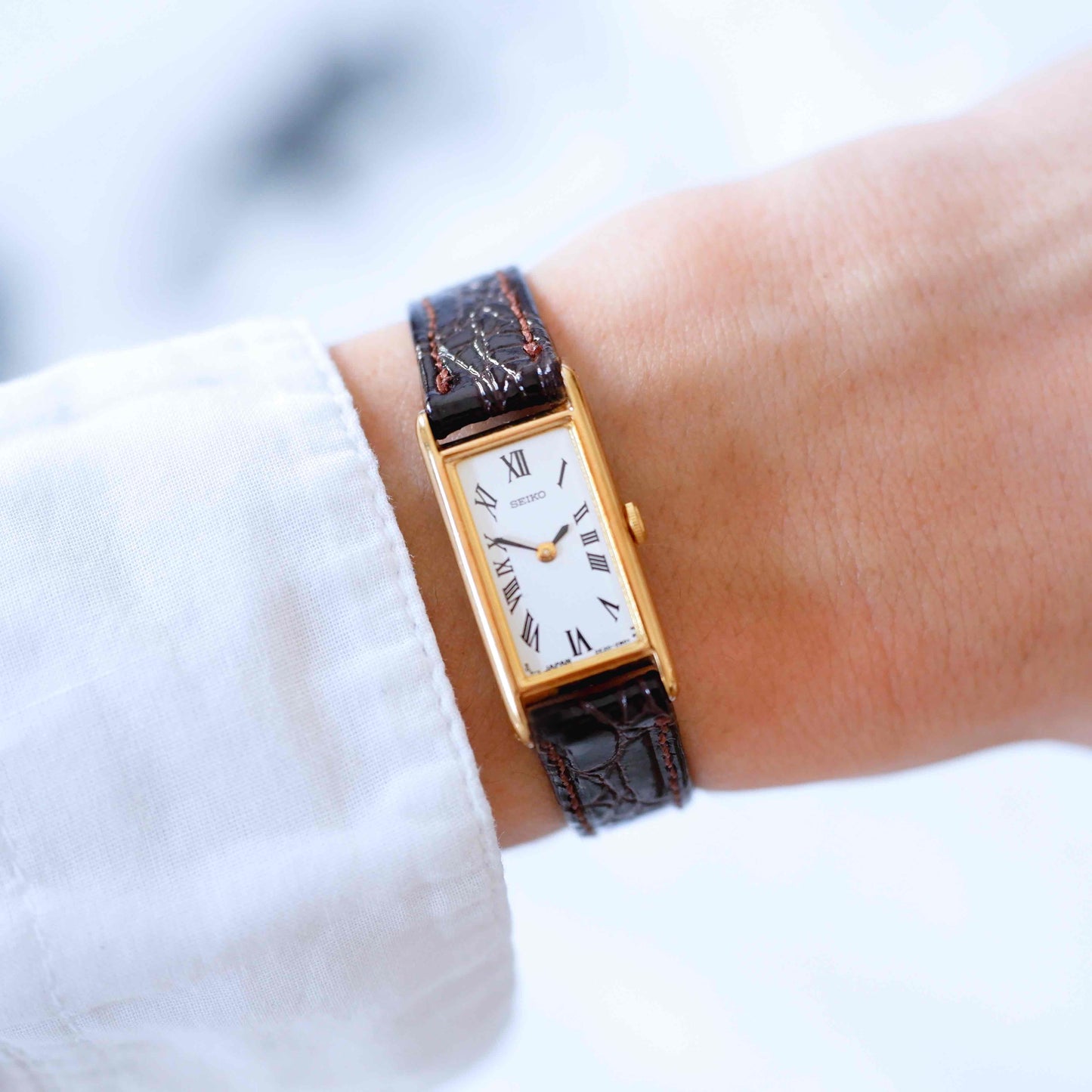 Seiko Vintage Watch: Ladies 80s Gold Rectangular with White Roman Dial