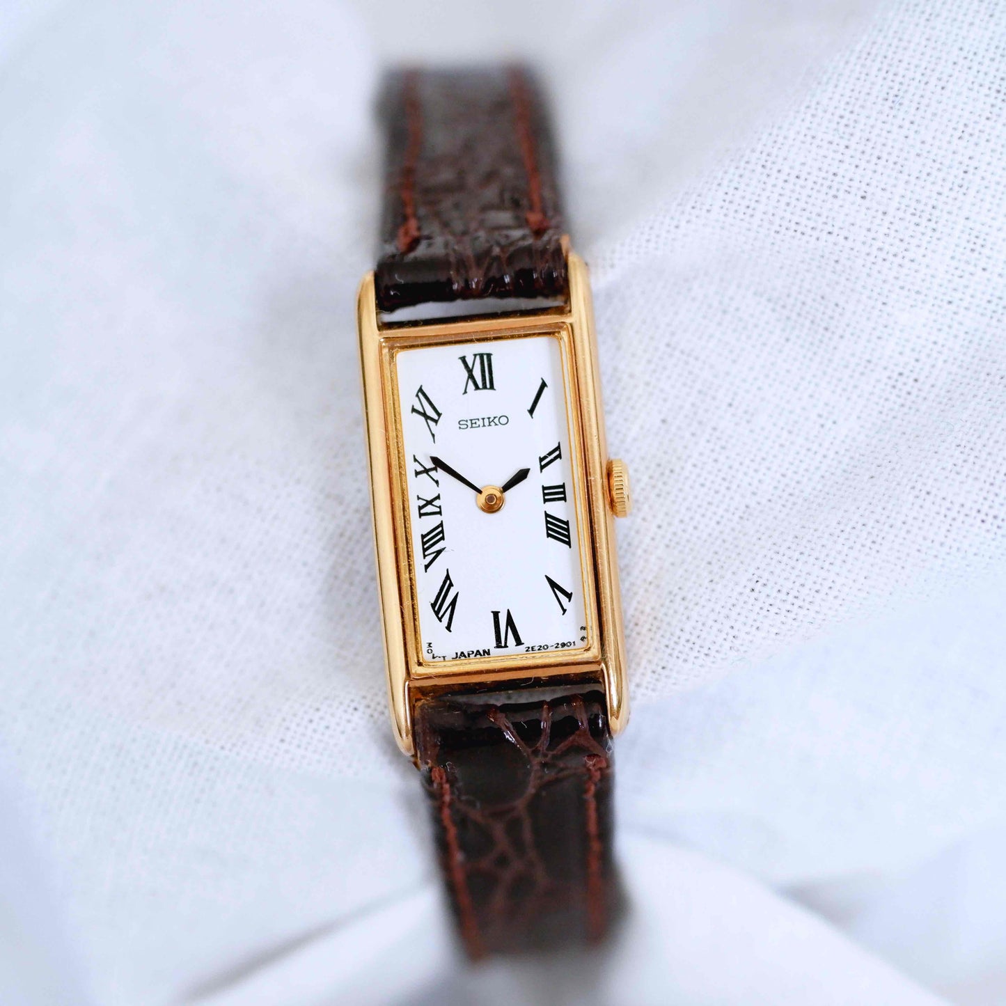 Seiko Vintage Watch: Ladies 80s Gold Rectangular with White Roman Dial