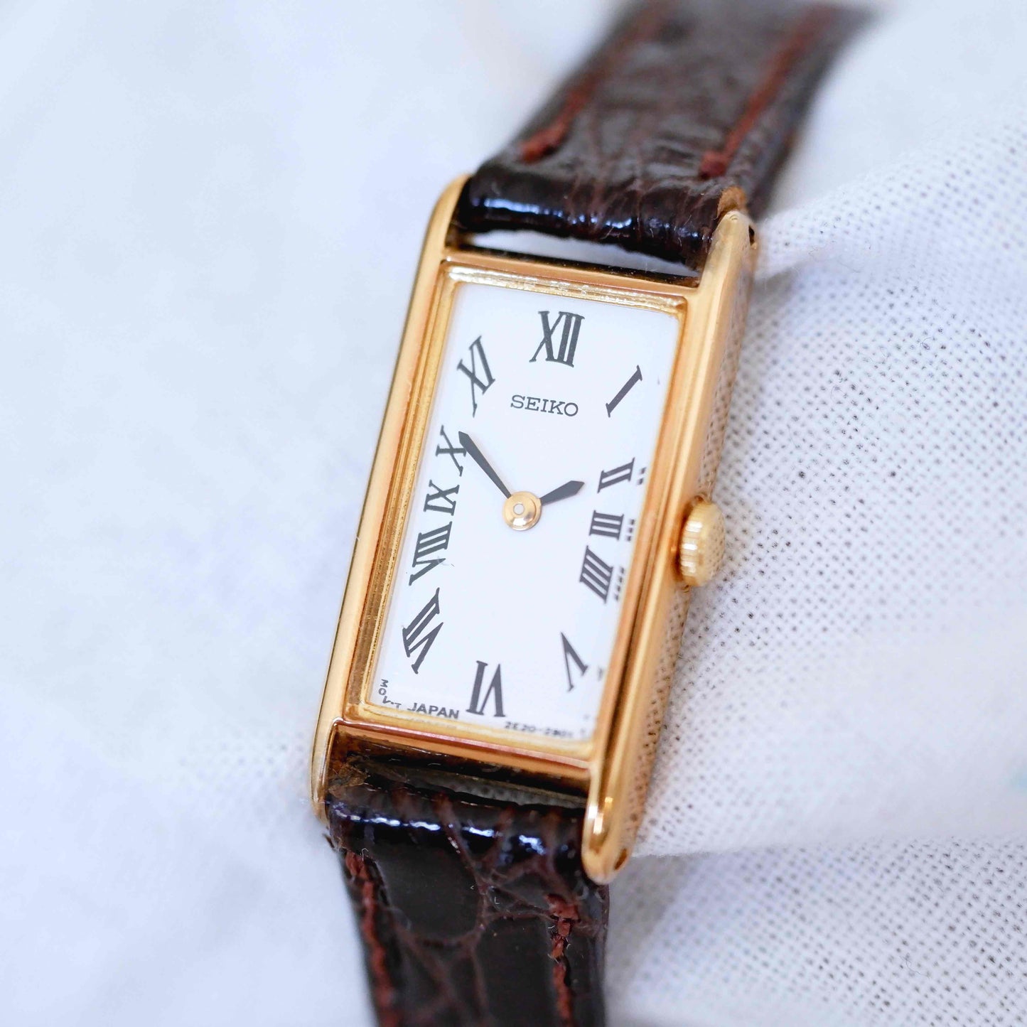 Seiko Vintage Watch: Ladies 80s Gold Rectangular with White Roman Dial