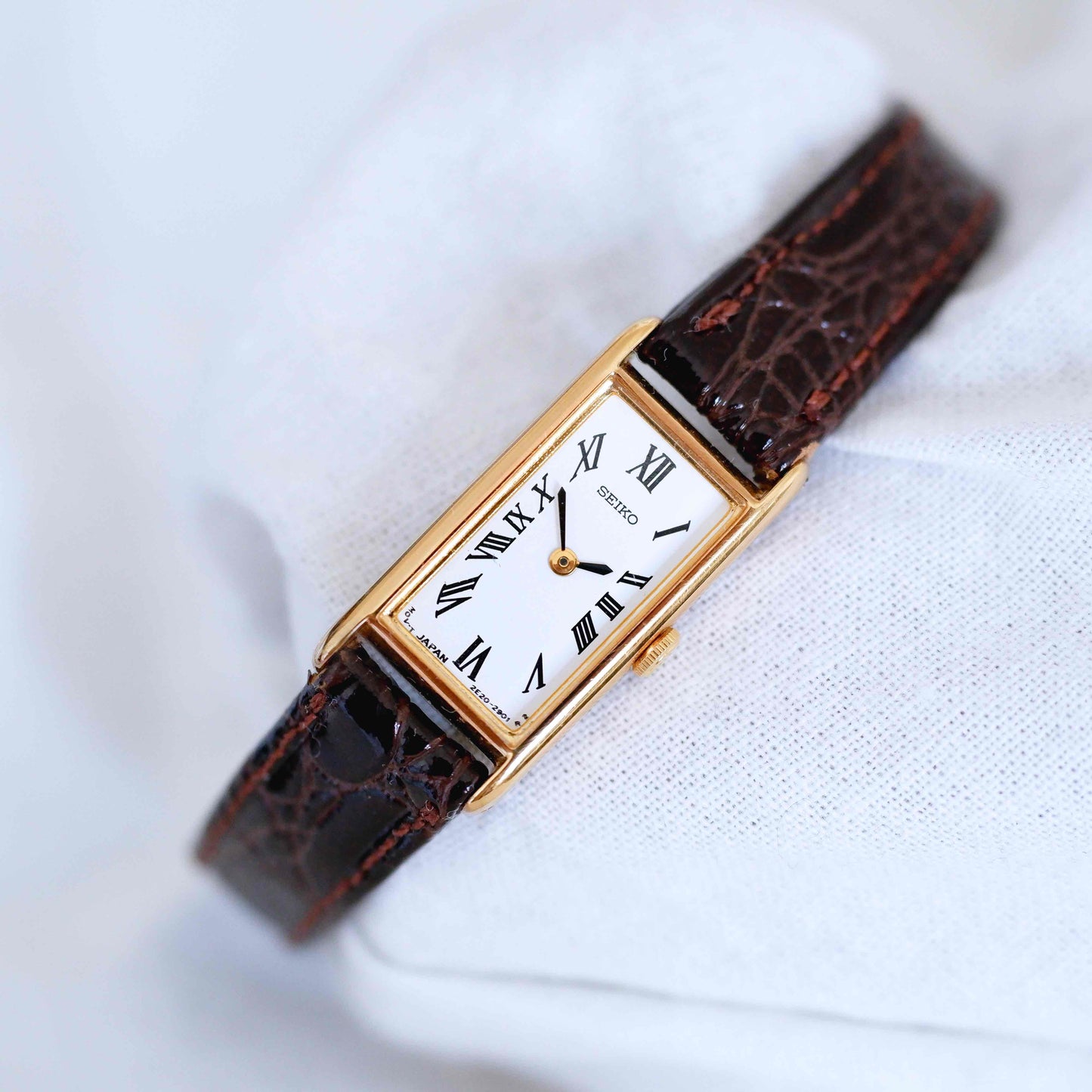 Seiko Vintage Watch: Ladies 80s Gold Rectangular with White Roman Dial