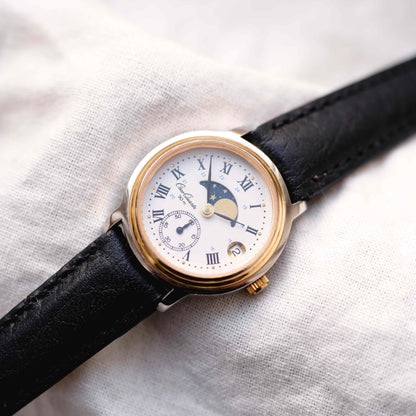 Osco Moon Phase Watch: Ladies 90s Gold with Roman Numerals Blue White Dial