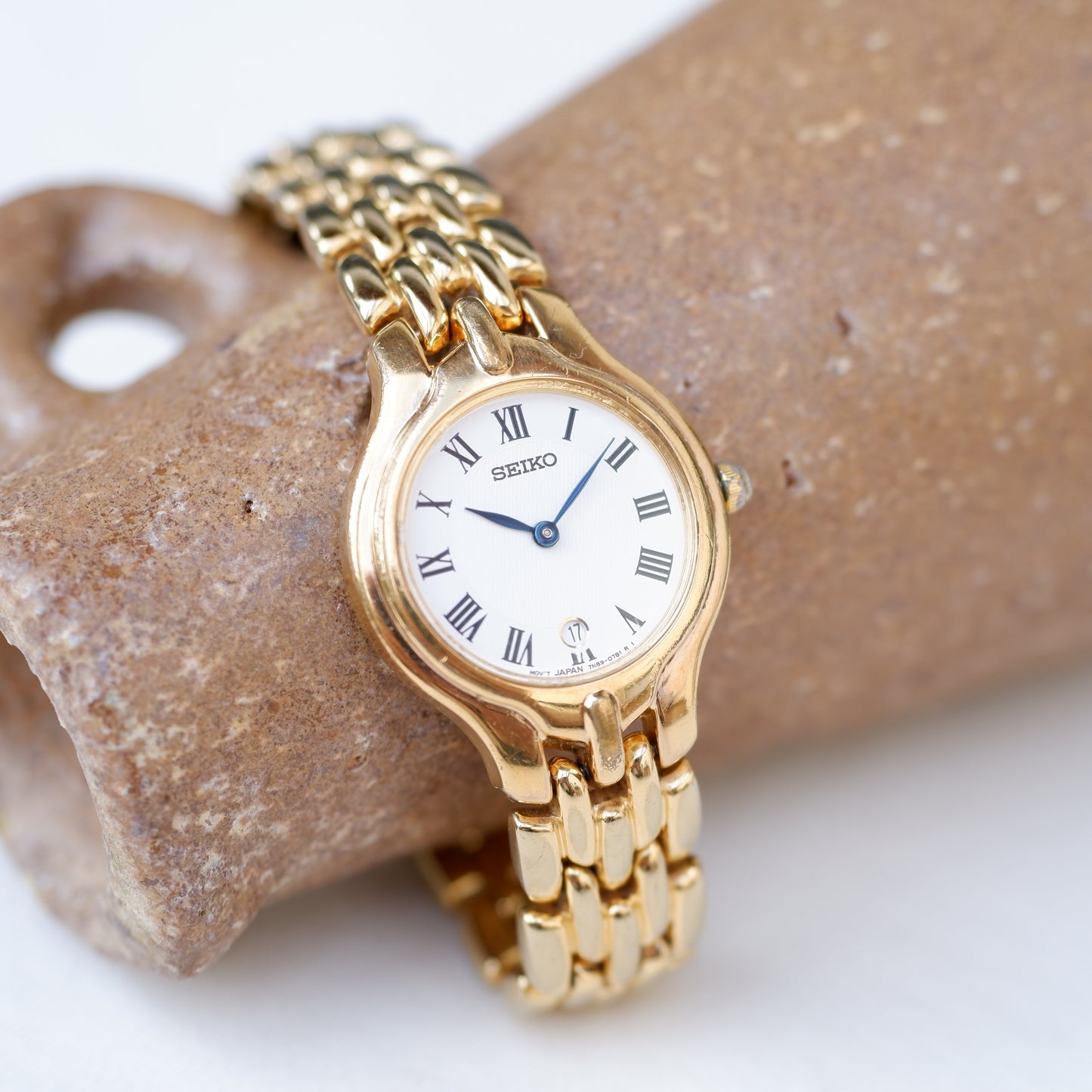 Seiko Vintage Watch: Ladies 80s Golden Blued Hands White Roman Dial