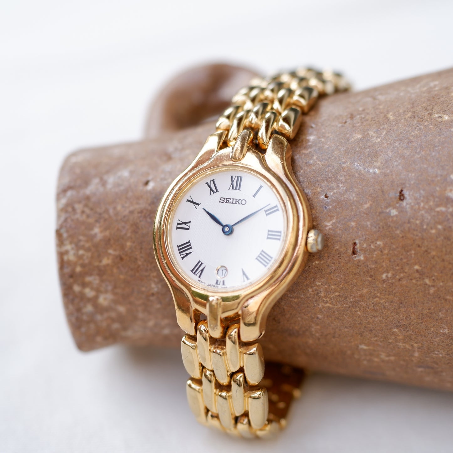 Seiko Vintage Watch: Ladies 80s Golden Blued Hands White Roman Dial