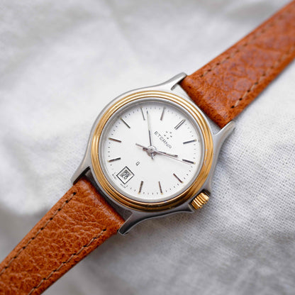 Eterna Vintage Watch: Ladies 80s Gold with White Linen Dial