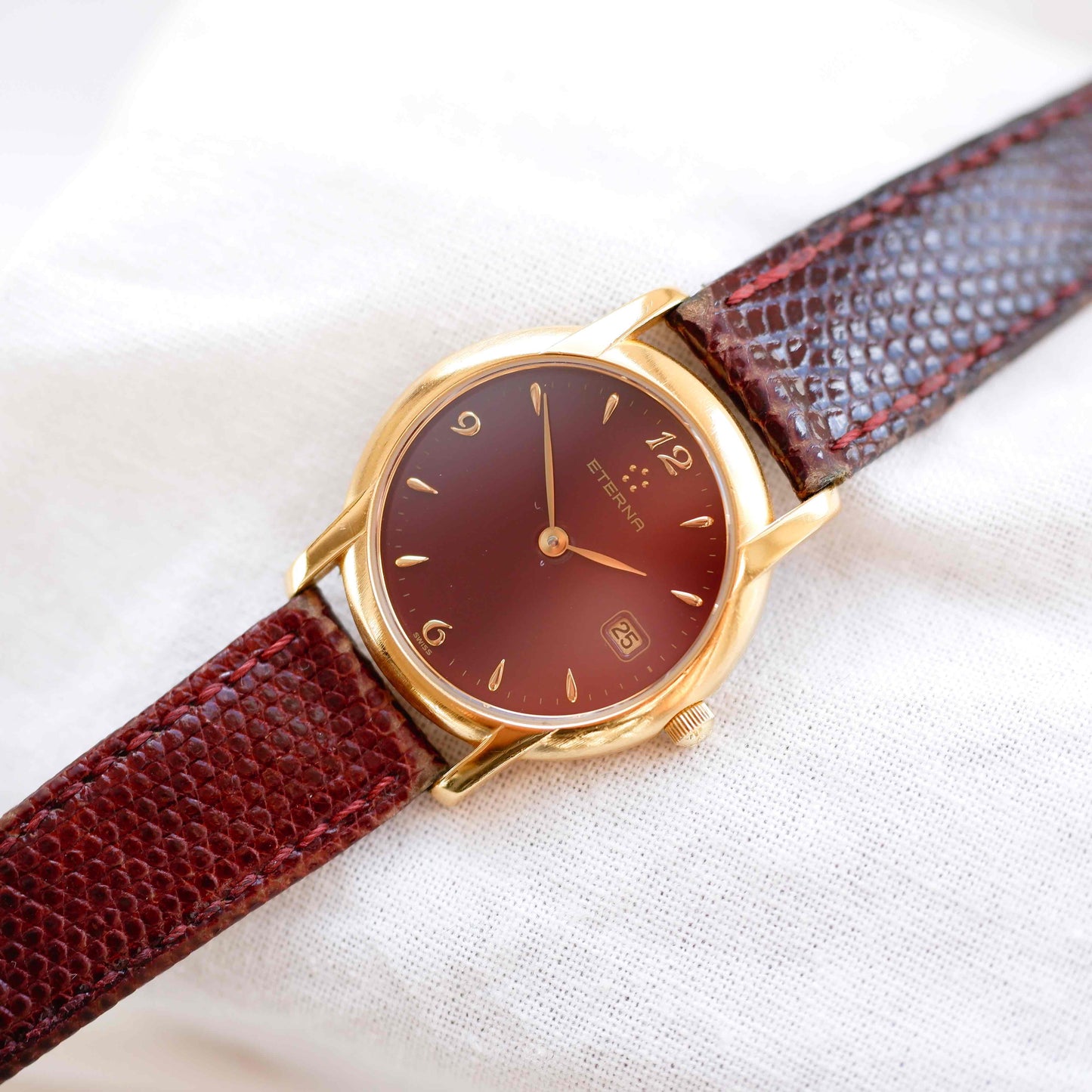 Eterna Vintage Watch: Ladies 90s Gold with Burgundy Colored Dial