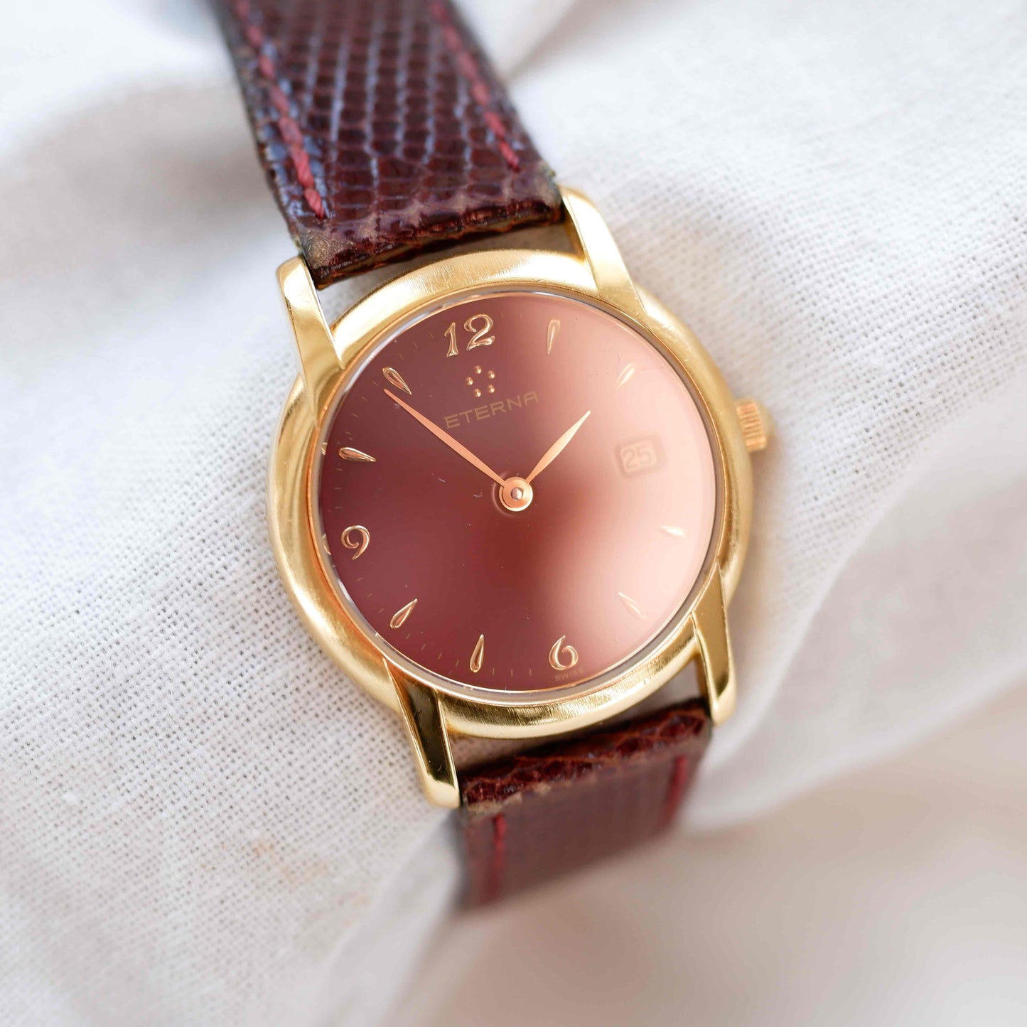 Eterna Vintage Watch: Ladies 90s Gold with Burgundy Colored Dial