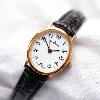 Dugena Oval Watch: Ladies Dainty 90s Gold with White Dial - NOS
