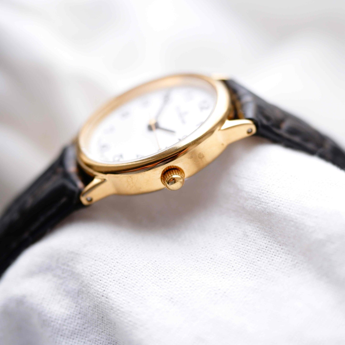 Dugena Oval Watch: Ladies Dainty 90s Gold with White Dial - NOS