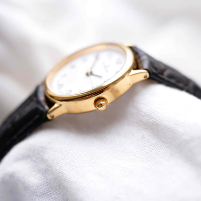 Dugena Oval Watch: Ladies Dainty 90s Gold with White Dial - NOS