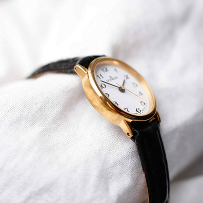 Dugena Oval Watch: Ladies Dainty 90s Gold with White Dial - NOS