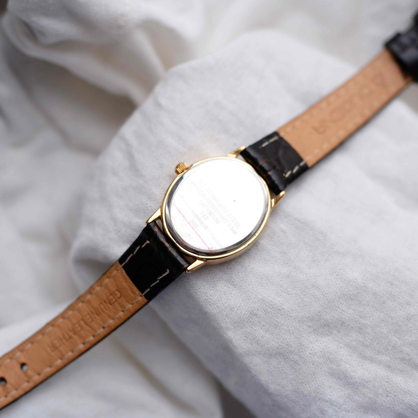 Dugena Oval Watch: Ladies Dainty 90s Gold with White Dial - NOS
