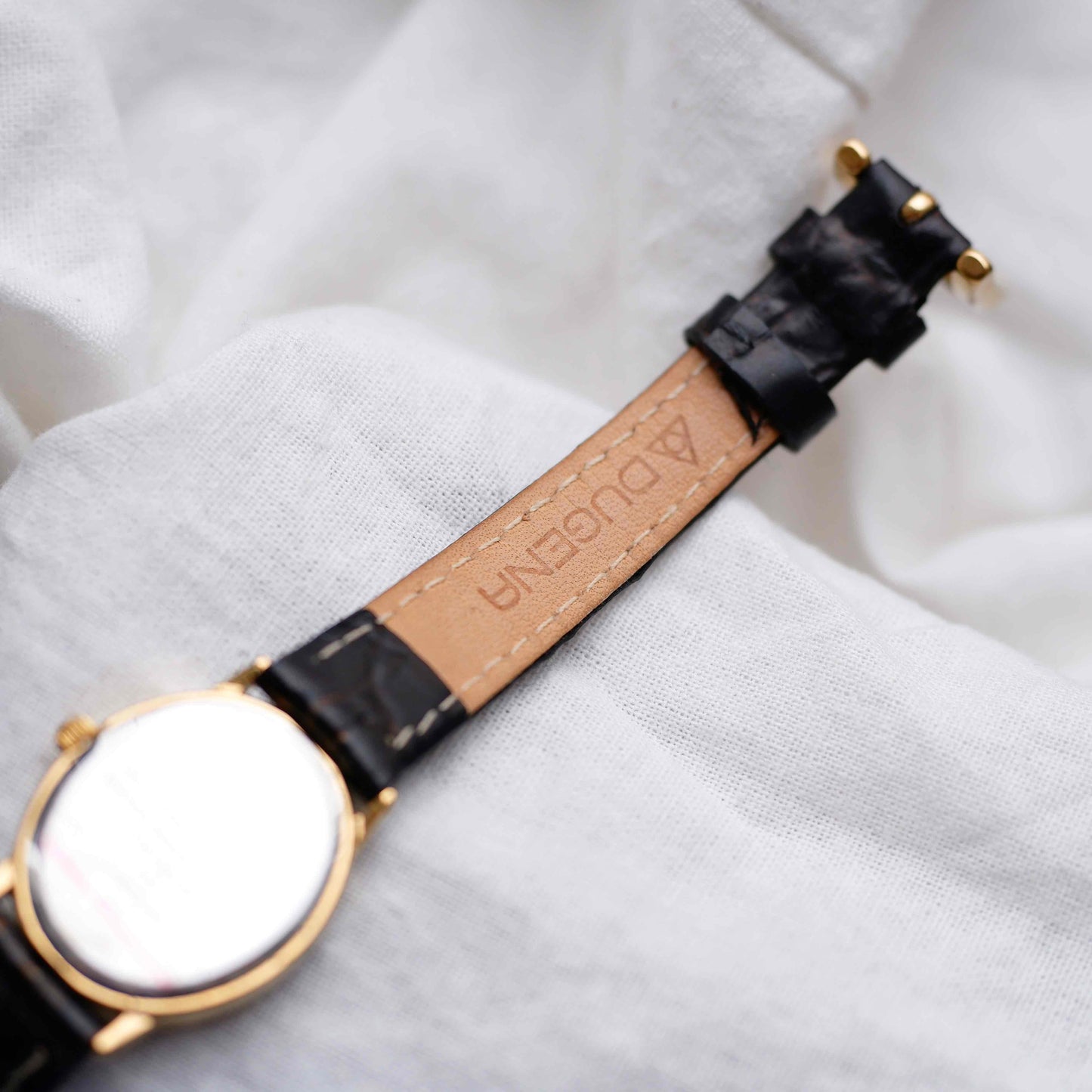 Dugena Oval Watch: Ladies Dainty 90s Gold with White Dial - NOS