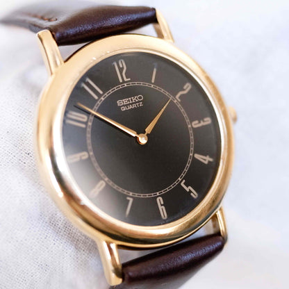 Seiko Vintage Watch: Ladies 90s Gold Two Hand with Roman Black Dial