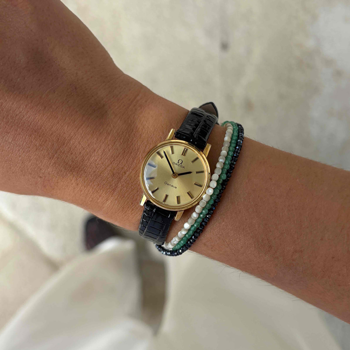 Omega Geneve Dainty: Ladies 70s Hand-Wound Sunburst Champagne Dial