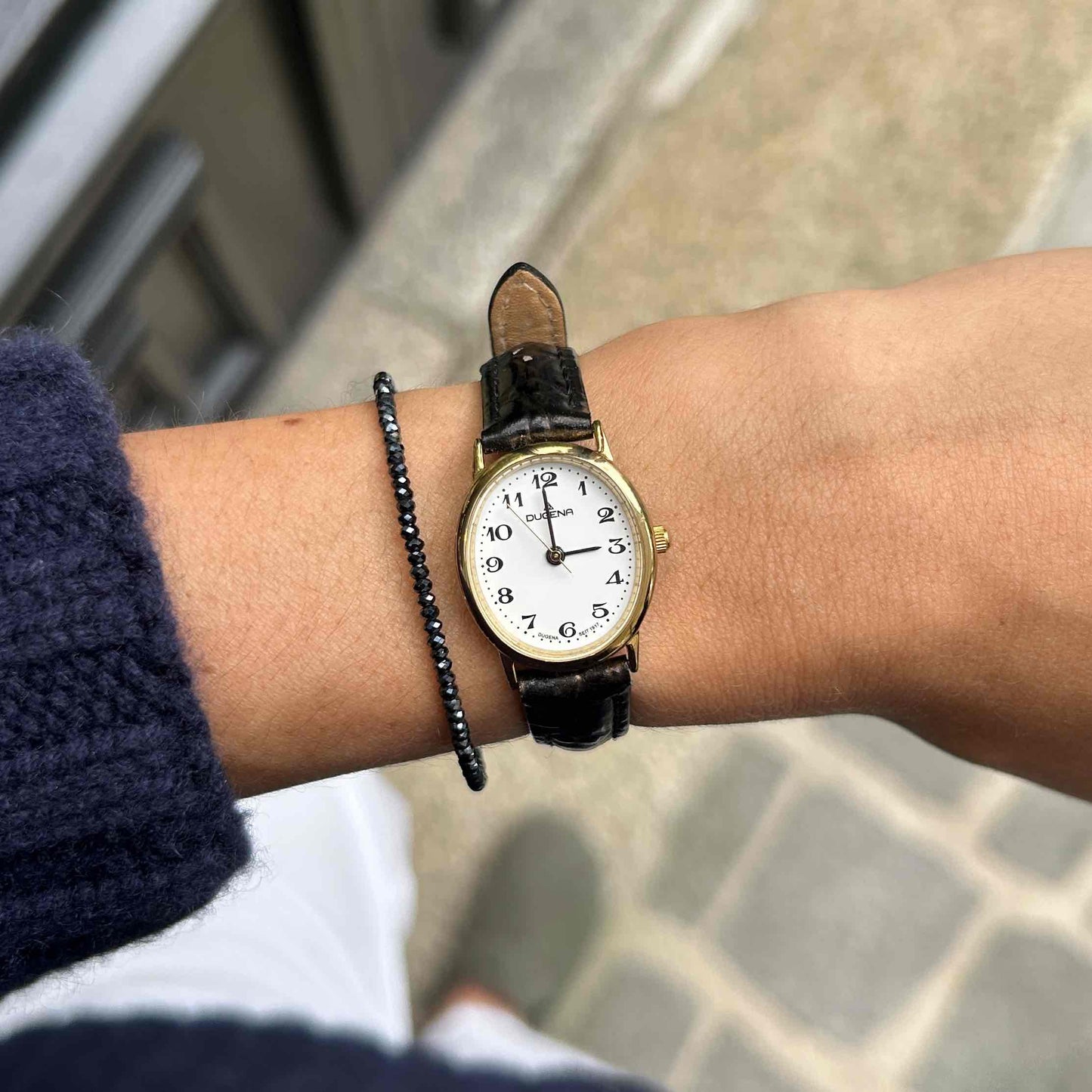 Dugena Oval Watch: Ladies Dainty 90s Gold with White Dial - NOS