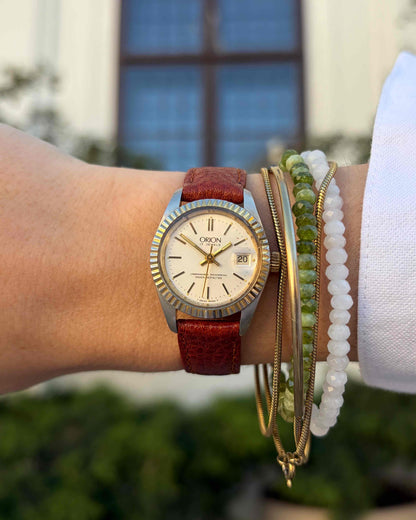 Orion Ladies Watch: Vintage Mechanical Fluted Bezel 70s Gold Two-Tone Sunburst Dial