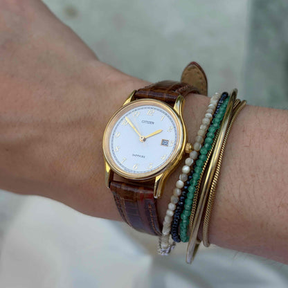 Citizen Ladies Watch: Vintage Dainty 80s Golden Structured Guilloche Dial
