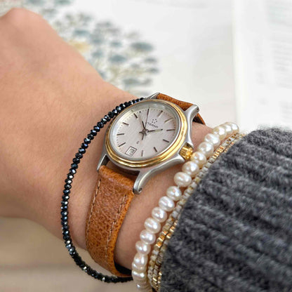 Eterna Vintage Watch: Ladies 80s Gold with White Linen Dial