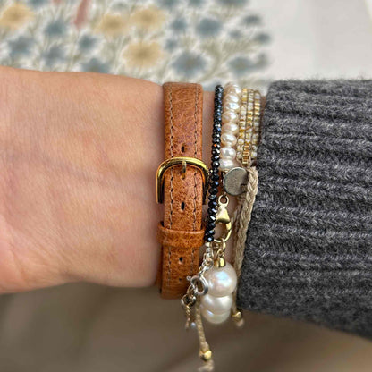 Eterna Vintage Watch: Ladies 80s Gold with White Linen Dial