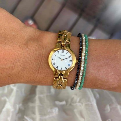 Pulsar by Seiko Cocktail Watch: Vintage Ladies 80s Golden with White Roman Dial