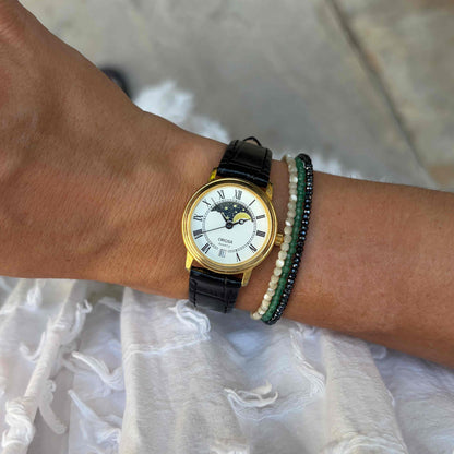 Oriosa Moon Phase Watch: Ladies 90s Gold with Roman Numerals Blue White Dial