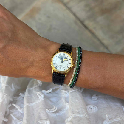 Oriosa Moon Phase Watch: Ladies 90s Gold with Roman Numerals Blue White Dial