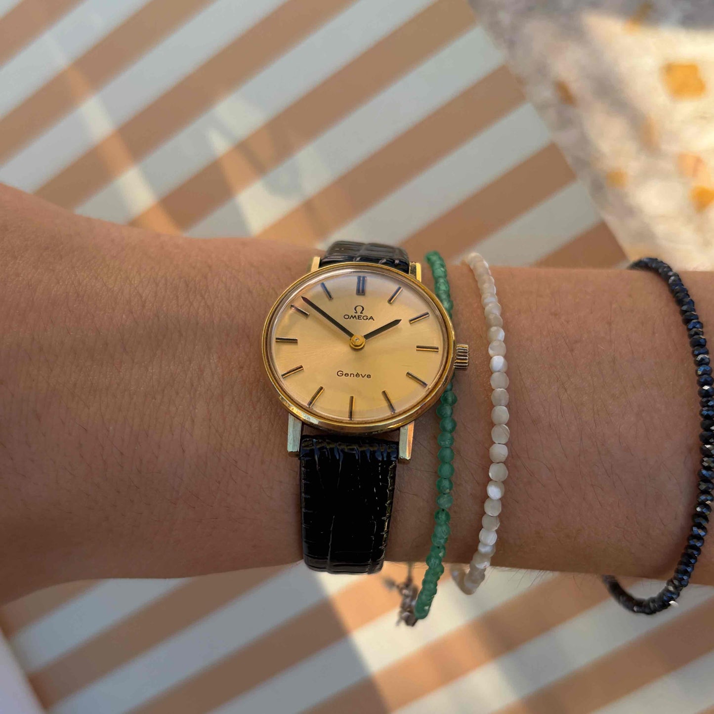 Omega Geneve Dainty: Ladies 70s Hand-Wound Sunburst Champagne Dial