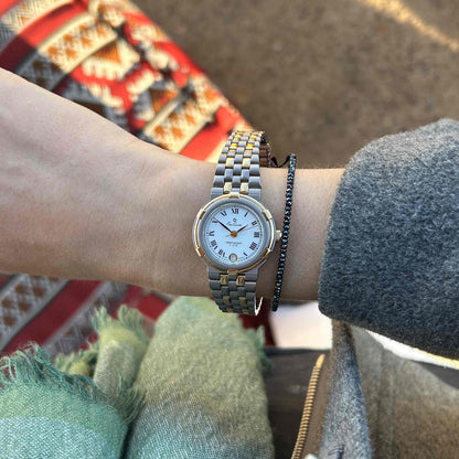 Vintage Osco Titan: Ladies 90s Gold with Elegant White Roman Dial - NOS