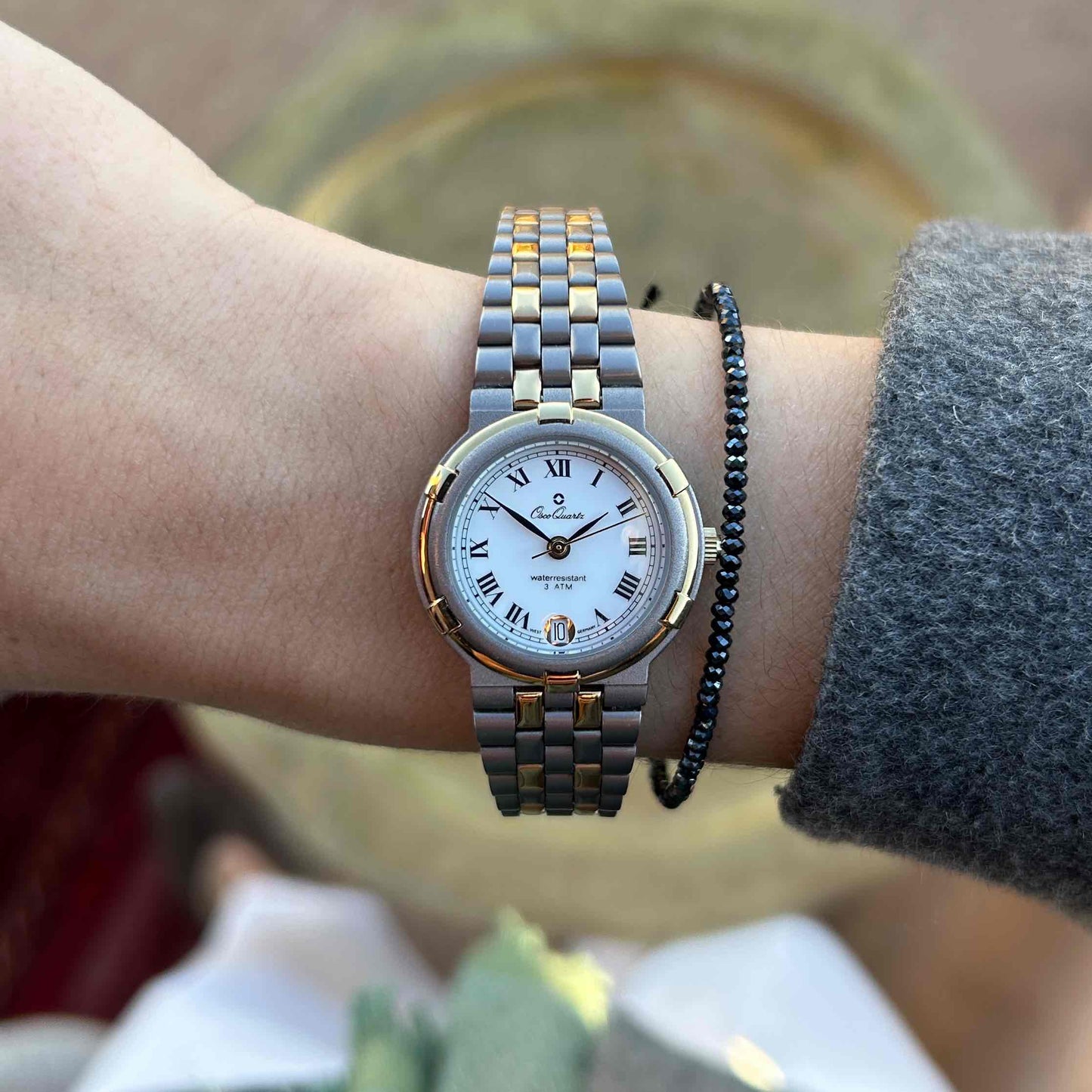 Vintage Osco Titan: Ladies 90s Gold with Elegant White Roman Dial - NOS