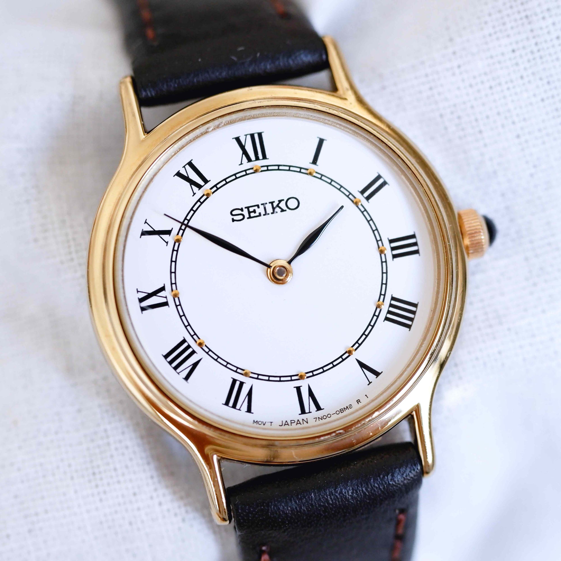 Seiko Vintage Ladies Watch: 90s Gold with Elegant Roman Numerals, First Slight Left Side