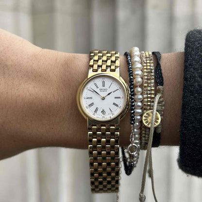 Seiko Vintage Watch: Ladies 90s Golden Roman White Dial